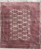 A MODERN BOKHARA RUG Having beige ground central field and fifteen running border. (approx 128cm x