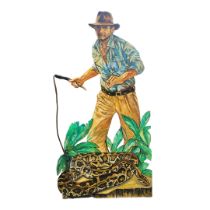 A LARGE WOODEN THEATRE PROP, SCENE OF INDIANA JONES Stood above a snake and yielding a rope whip. (w