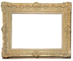 A 19TH CENTURY GILDED RECTANGULAR PICTURE FRAME With carved scrolled decoration. (aperture approx