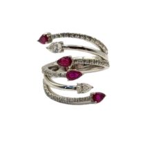 AN 18CT WHITE GOLD, RUBY AND DIAMOND CLUSTER RING Four pear cut rubies interspersed with diamonds in