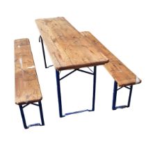 A PINE AND IRON FOLDING TRESTLE TABLE AND TWO BENCHES. (199cm x 51cm x 78cm) Condition: some light