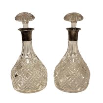 MAPPIN AND WEBB, A PAIR OF EARLY 20TH CENTURY SILVER AND CUT GLASS DECANTERS Having mushroom form