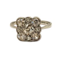 AN EARLY 20TH CENTURY 18CT WHITE GOLD DIAMOND CLUSTER RING The arrangement of round cut diamonds