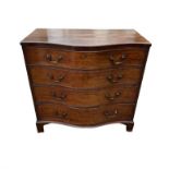 AN EARLY 19TH CENTURY MAHOGANY SERPENTINE CHEST Of four graduating drawers, fitted with brass swan