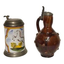 WITHDRAWN!!A 19TH CENTURY GERMAN POTTERY AND PEWTER FLAGON Having a single handle and