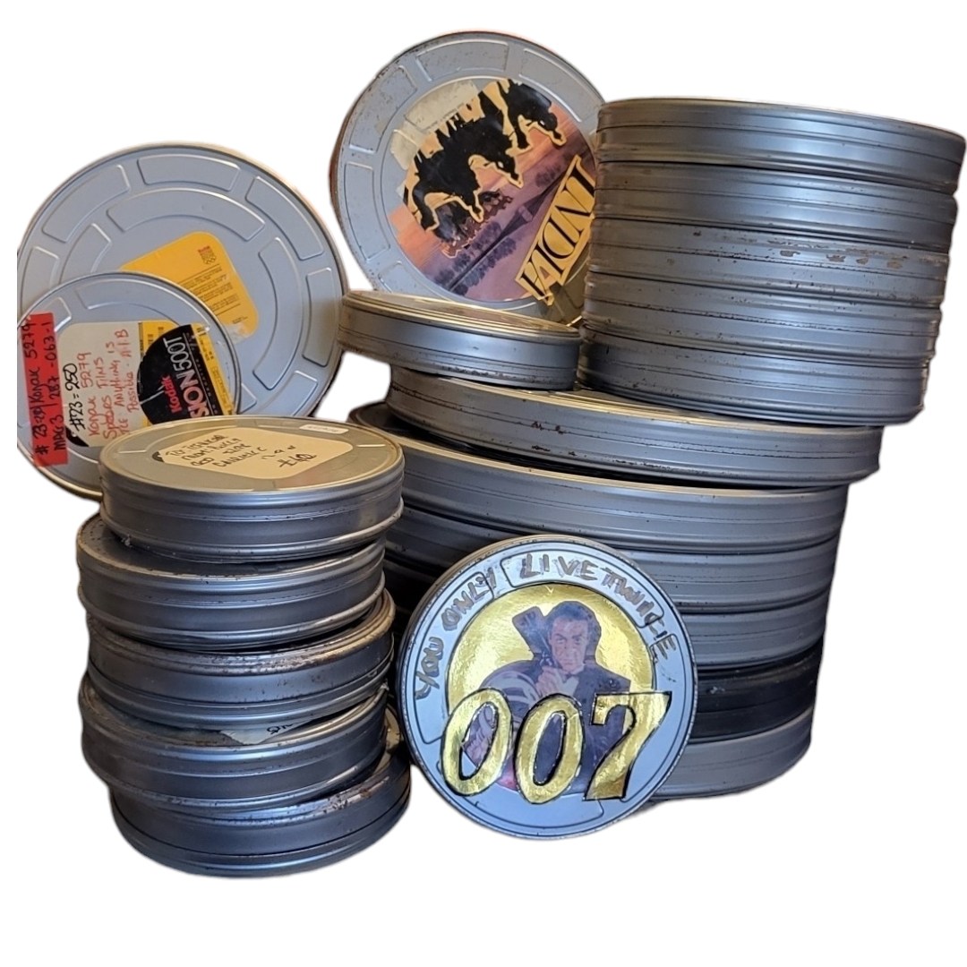 A COLLECTION OF EMPTY TIN KODAK FILM REEL CANISTERS Various sizes. (largest w 38cm x h 4cm)