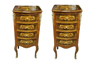 A PAIR CONTINENTAL WALNUT, MAHOGANY AND MARQUETRY INLAID BOW FRONTED PEDESTAL CHEST Having an