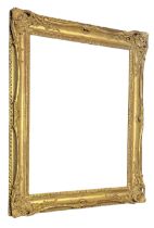 A 19TH CENTURY WATER GILDED RECTANGULAR PICTURE FRAME With a rolled decoration. (aperture approx