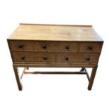 HEAL & SON LTD OF LONDON, AN EARLY/MID 20TH CENTURY OAK SIDE CABINET Having an arrangement of five