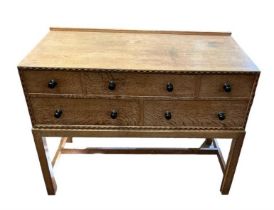 HEAL & SON LTD OF LONDON, AN EARLY/MID 20TH CENTURY OAK SIDE CABINET Having an arrangement of five