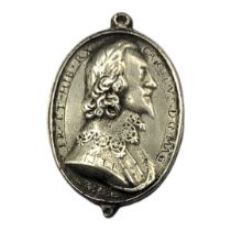 KING CHARLES I, 1625 - 1649, A SILVER OVAL ROYALIST BADGE Embossed portrait engraved with