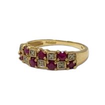 A VINTAGE 9CT GOLD, RUBY AND DIAMOND HALF ETERNITY RIMG Two rows of round cut rubies interspersed