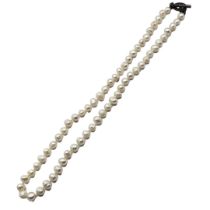 A CONTINENTAL WHITE METAL AND PEARL NECKLACE Having a circular form clasp. (approx 60cm)