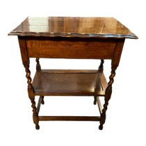 AN EARLY 20TH CENTURY OAK TWO TIER OCCASIONAL TABLE The piecrust rise and fall top enclosing