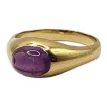 A 14CT GOLD AND AMETHYST RING The cabochon cut stone in plain form mount. (size L) Condition: good