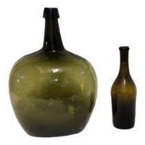 A LARGE 18TH/EARLY 19TH CENTURY ITALIAN GREEN GLASS DEMIJOHN WINE BOTTLE Having a tapered collar and