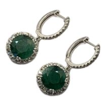 A PAIR OF 18CT WHITE GOLD, EMERALD AND DIAMOND EARRINGS The faceted round cut emerald edged with