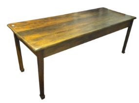 A FARMHOUSE SOLID OAK REFECTORY TABLE The six plank top, raised on square tapering legs. (192cm x