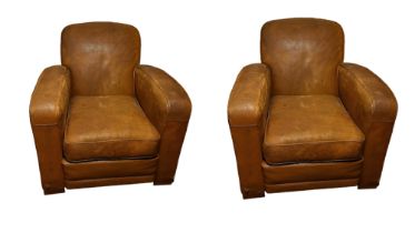 A PAIR OF MID CENTURY ART DECO TAN LEATHER UPHOLSTERED CLUB ARMCHAIRS With over sprung arms and