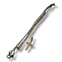 A VINTAGE 14CT GOLD CRUCIFIX PENDANT The textured crucifix on a plain 14ct gold necklace. (