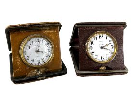 J.W. BENSON, LONDON. AN ART DECO LEATHER CASED TRAVELLING CLOCK AND ONE OTHER Both having eight