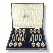 HOPKINS & HOPKINS, IRELAND, A CASED SET OF TWELVE ART-DECO IRISH SILVER SPOONS & SUGAR TONGS,