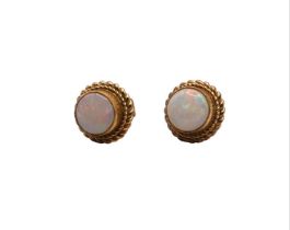 A PAIR OF 9CT GOLD AND OPAL EARRINGS Bezel set round opals within two decorative rope twist borders.