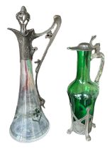 AN EARLY 20TH CENTURY ART NOUVEAU WMF PEWTER AND GLASS CLARET JUG Together with another pewter and