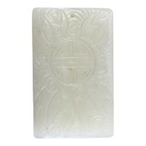 A CHINESE WHITE JADE ‘NINE BATS’ CARVED PLAQUE Pendant having five carved bats amongst swirls, the