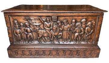 A RARE 15TH CENTURY FRENCH CARVED WALNUT COFFER, With hinge lid above carved panel in