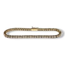 A 14CT GOLD AND CLEAR STONE TENNIS BRACELET. (approx length 19cm, gross weight 9.1g)