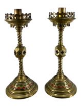 A PAIR OF 19TH CENTURY GILT METAL GOTHIC STYLE CANDLESTICKS Having repeating cold painted green