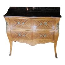 A FRENCH KINGWOOD BOMBE CHEST With peach glass mirrored top above two drawers applied with gilt