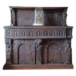 A 19TH CENTURY HEAVILY CARVED OAK FLEMISH DRESSER Figured with fleur-de-lis, and crowns, leaves,