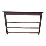 A GEORGIAN OAK WALL MOUNTING WATERFALL PLATE RACK. (186cm x 19cm x 123cm) Condition: good overall