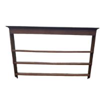 A GEORGIAN OAK WALL MOUNTING WATERFALL PLATE RACK. (186cm x 19cm x 123cm) Condition: good overall