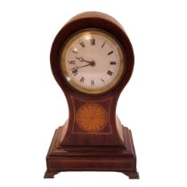 AN EDWARDIAN MAHOGANY CASED MANTEL TIMEPIECE Inlaid with circular fan pattera, the white enamel dial