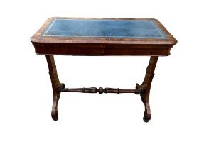 A VICTORIAN FAUX WALNUT FOLD OVER WRITING GAMES TABLE With blue tooled leather surface enclosing a