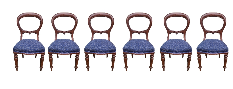 A SET OF SIX VICTORIAN MAHOGANY SPOON BACK DINING CHAIRS Carved back rail, overstuffed blue fabric