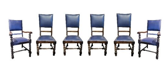 A SET OF SIX CROMWELLIAN STYLE OAK DINING CHAIRS Including two carvers, in blue faux leather
