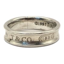 TIFFANY, A VINTAGE SILVER WEDDING BAND Concede from, marked ‘T and Co. 1837’. (size U) Condition: