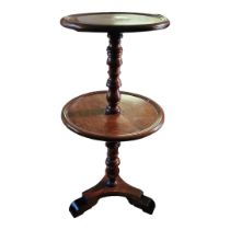 A GEORGIAN MAHOGANY TWO TIER DUMB WAITER With turned column supports on tripod legs. (approx 38cm