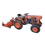 A VINTAGE B7100 KUBOTA COMPACT TRACTOR Diesel, with grass cutter trailer. Condition: in working