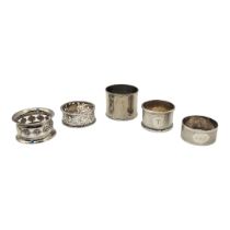 A COLLECTION OF EARLY 20TH CENTURY SILVER AND WHITE METAL SERVIETTE RINGS To include three of