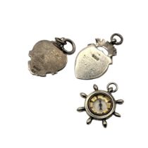 A COLLECTION OF THREE VINTAGE SILVER POCKET WATCH FOBS To include a compass ship's wheel and a fob