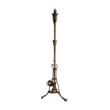 A VICTORIAN BRASS TELESCOPIC STANDARD LAMP Scrollwork paw feet. (130cm) Condition: later