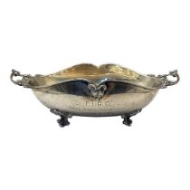 A 20TH CENTURY GERMAN SILVER TWIN HANDLED BOWL Scrolled Rococo form on four legs and presentation