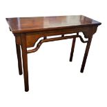 A CHINESE HARDWOOD ALTAR TABLE The rectangular top above a pierced apron, raised on turned legs. (