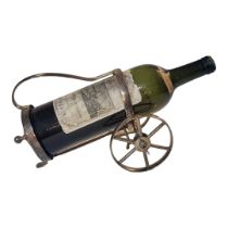 A VINTAGE SILVER PLATED WINE BOTTLE HOLDER/TROLLEY Having a single handle, two carriage wheels