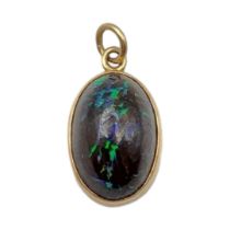 A LATE 19TH/EARLY 20TH CENTURY 15CT GOLD OPAL PENDANT The cabochon cut opal in a 15ct gold frame. (